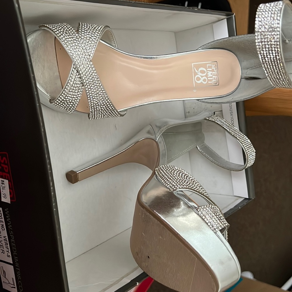 Brand New High Heel Silver and diamonds.